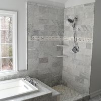 Standing shower and tub remodel with beautiful marble tile.